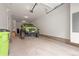 Garage with a green jeep and a lot of extra space at 2225 Santini Trl # C, Littleton, CO 80129