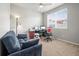 Functional office space with a comfortable couch and natural light at 2225 Santini Trl # C, Littleton, CO 80129