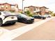 Convenient parking area with several cars parked in front of townhomes at 2225 Santini Trl # C, Littleton, CO 80129