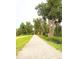 Scenic walking path with lush greenery and mature trees, perfect for outdoor recreation at 2225 Santini Trl # C, Littleton, CO 80129