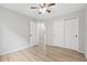 Bedroom with hardwood floors, ceiling fan and closet at 8773 S Dudley St, Littleton, CO 80128