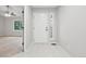 Bright foyer with tile flooring and natural light at 8773 S Dudley St, Littleton, CO 80128