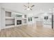 Bright and spacious living room featuring hardwood floors and a cozy fireplace at 8773 S Dudley St, Littleton, CO 80128