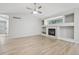 Spacious living room showcasing a fireplace and large windows for natural light at 8773 S Dudley St, Littleton, CO 80128