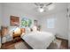 Cozy bedroom with bright windows, stylish decor, and hardwood floors at 3231 S Elati St, Englewood, CO 80110