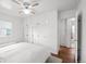 Well-lit bedroom featuring closet space, bright windows, and hardwood floors at 3231 S Elati St, Englewood, CO 80110