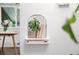 Charming alcove niche with potted plant and books, adding character and warmth to the space at 3231 S Elati St, Englewood, CO 80110
