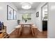 Cozy dining room with modern light fixture, hardwood floors, and stylish seating for intimate meals at 3231 S Elati St, Englewood, CO 80110