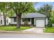 Charming single-story home with well-maintained lawn, attached garage, and mature shade tree at 3231 S Elati St, Englewood, CO 80110
