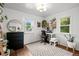 Bright office space with modern desk, ample natural light, and hardwood floors at 3231 S Elati St, Englewood, CO 80110