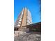 Tall condo building boasts a mix of brick and white balconies against a clear blue sky at 1250 N Humboldt St # 202, Denver, CO 80218