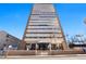 View of the Embassy House high rise with balconies on each floor against a blue sky at 1250 N Humboldt St # 202, Denver, CO 80218