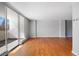 Bright living area featuring hardwood floors, neutral walls, and expansive windows for lots of natural light at 1250 N Humboldt St # 202, Denver, CO 80218