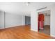 Bright living room with hardwood floors and light gray walls provides an open space at 1250 N Humboldt St # 202, Denver, CO 80218