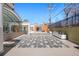 Beautiful patio area with a uniquely patterned concrete surface and lots of space for entertaining and enjoying the outdoors at 1250 N Humboldt St # 202, Denver, CO 80218