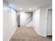 Finished basement hallway leading to carpeted stairs and other basement areas at 1054 Magnolia St, Denver, CO 80220