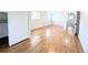 Bedroom with hardwood floors, neutral paint, and sliding closet doors at 1054 Magnolia St, Denver, CO 80220