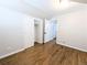 Bright bedroom featuring a closet, hardwood floors, and neutral walls at 1054 Magnolia St, Denver, CO 80220