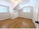 Bedroom featuring wood floors, dormer nook, and windows with blinds at 1054 Magnolia St, Denver, CO 80220