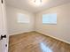Bedroom featuring wood floors and lots of natural light at 1054 Magnolia St, Denver, CO 80220
