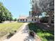 Charming home exterior featuring a well-manicured lawn and walkway to the front door at 1054 Magnolia St, Denver, CO 80220
