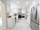 Modern kitchen featuring stainless steel appliances and white cabinets at 1054 Magnolia St, Denver, CO 80220