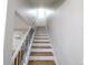 Bright staircase with oak treads, white risers and white banister with black spindles at 1054 Magnolia St, Denver, CO 80220