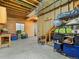 Partially finished basement offers ample storage space, wood paneled wall, and concrete floor at 11910 W 83Rd Pl, Arvada, CO 80005