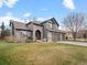 Beautiful home with stone accents, manicured lawn, and a welcoming front entrance at 11910 W 83Rd Pl, Arvada, CO 80005