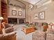 Cozy living room with fireplace and bright, natural light at 11910 W 83Rd Pl, Arvada, CO 80005