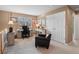 Comfortable home office features a desk, chair, decorative cabinet, and natural light from the exterior at 11910 W 83Rd Pl, Arvada, CO 80005