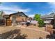 This backyard features a brick patio, gravel, seating area, grill, and a fire pit at 3730 Lowell Blvd, Denver, CO 80211