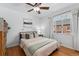Comfortable bedroom with hardwood floors, lots of natural light, and a cozy queen bed at 3730 Lowell Blvd, Denver, CO 80211