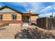 This charming brick home features a covered porch and low maintenance gravel landscaping at 3730 Lowell Blvd, Denver, CO 80211