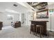 Finished basement with a stylish bar area, comfortable seating, and a cozy atmosphere at 2188 Abigail Ln, Castle Rock, CO 80104