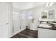 Bathroom featuring a double sink vanity and a walk-in shower with glass enclosure at 2188 Abigail Ln, Castle Rock, CO 80104