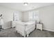 Bright bedroom with a white bed, neutral carpet, and natural light from the window at 2188 Abigail Ln, Castle Rock, CO 80104