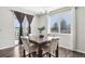 Bright dining area featuring a marble table set, natural lighting, and sliding door access at 2188 Abigail Ln, Castle Rock, CO 80104