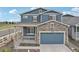 Beautiful two-story home boasts a stone-accented facade and a charming covered front porch at 2188 Abigail Ln, Castle Rock, CO 80104