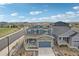 Charming two-story home featuring a stone facade, attached garage, and well-maintained landscaping at 2188 Abigail Ln, Castle Rock, CO 80104