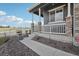 Charming front porch with stone pillar accents and well maintained landscaping, inviting curb appeal at 2188 Abigail Ln, Castle Rock, CO 80104