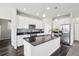 Modern kitchen with stainless steel appliances, granite countertops, and ample cabinet space at 2188 Abigail Ln, Castle Rock, CO 80104