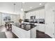 Stylish kitchen with a large island, modern appliances, and easy access to dining and living areas at 2188 Abigail Ln, Castle Rock, CO 80104