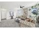 Spacious living room featuring neutral tones, ample natural light, and a cozy seating arrangement at 2188 Abigail Ln, Castle Rock, CO 80104