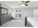 Spacious main bedroom featuring a ceiling fan, gray carpet, and access to a private balcony at 2188 Abigail Ln, Castle Rock, CO 80104
