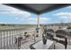 Relaxing covered porch with wicker furniture and panoramic views at 2188 Abigail Ln, Castle Rock, CO 80104