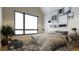 Serene bedroom featuring a large window, soft lighting, and stylish decor at 625 Lombardi Cir, Louisville, CO 80027