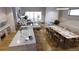 Open-concept space featuring a modern kitchen island, dining area, and comfortable living room seating at 625 Lombardi Cir, Louisville, CO 80027