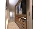 Well-organized walk-in closet with wooden shelving and ample storage space for clothing and accessories at 625 Lombardi Cir, Louisville, CO 80027