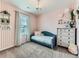 Charming bedroom with decorative accents, pastel colors, and whimsical details at 11657 Olathe St, Commerce City, CO 80022